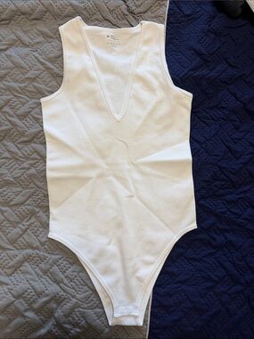 OQQ Woman’s White One-Piece Bodysuit